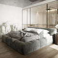 Italian upholstered bed frame in a modern bedroom with plush bedding and stylish decor.