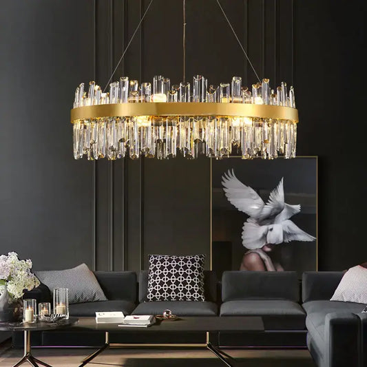 luxury crystal chandelier hanging elegantly in a modern living room with stylish decor.