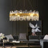 luxury crystal chandelier hanging elegantly in a modern living room with stylish decor.
