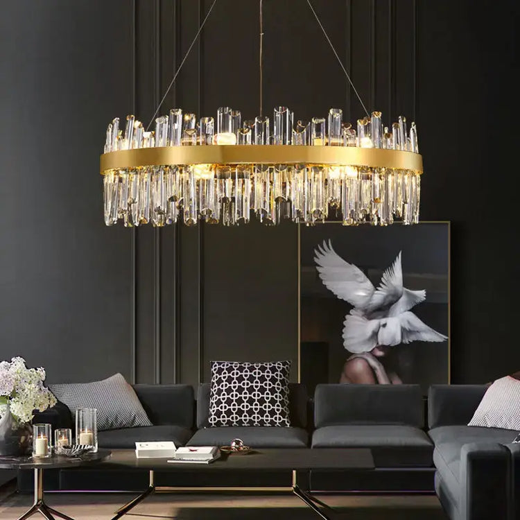 luxury crystal chandelier hanging elegantly in a modern living room with stylish decor.