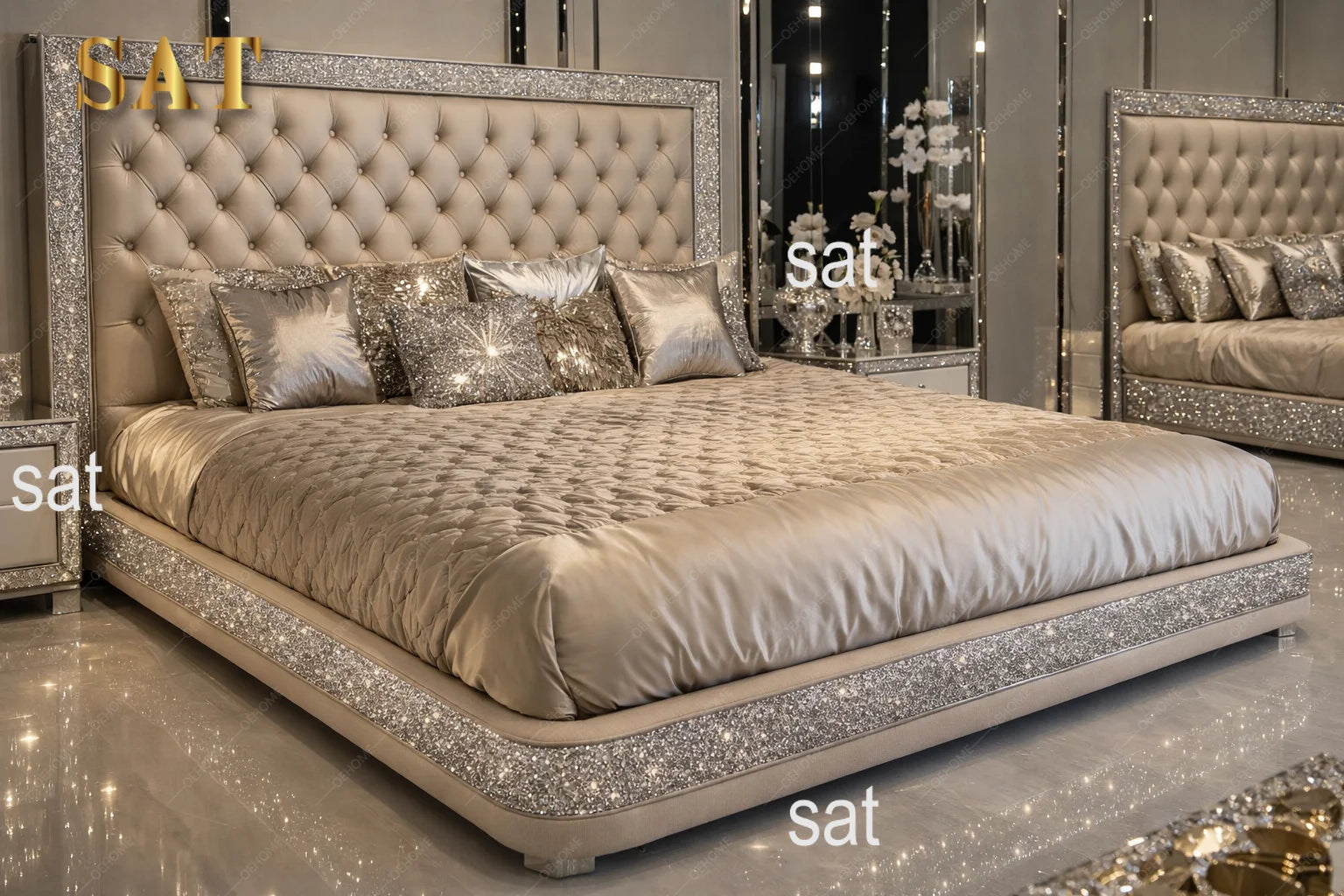 A luxury platform bed with a tufted beige headboard and footboard, heavily embellished with silver rhinestones, styled with matching tufted and patterned pillows in a mirrored bedroom setting.