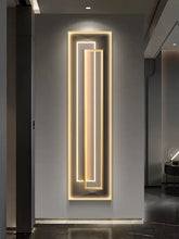 Modern LED mural light for modern decor illuminating a sleek vertical wall design.