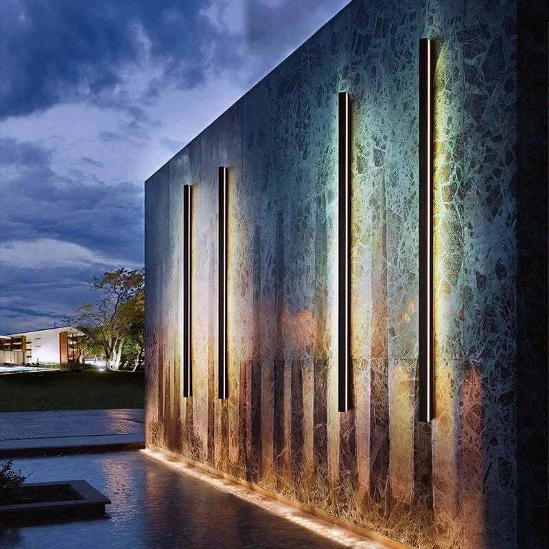 Modern waterproof outdoor wall light illuminating a stylish outdoor wall during twilight.