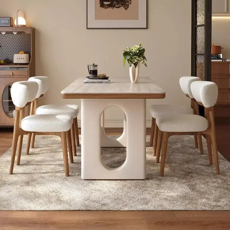 6 person white dining table with modern Nordic design and comfortable chairs in a stylish living room setting.