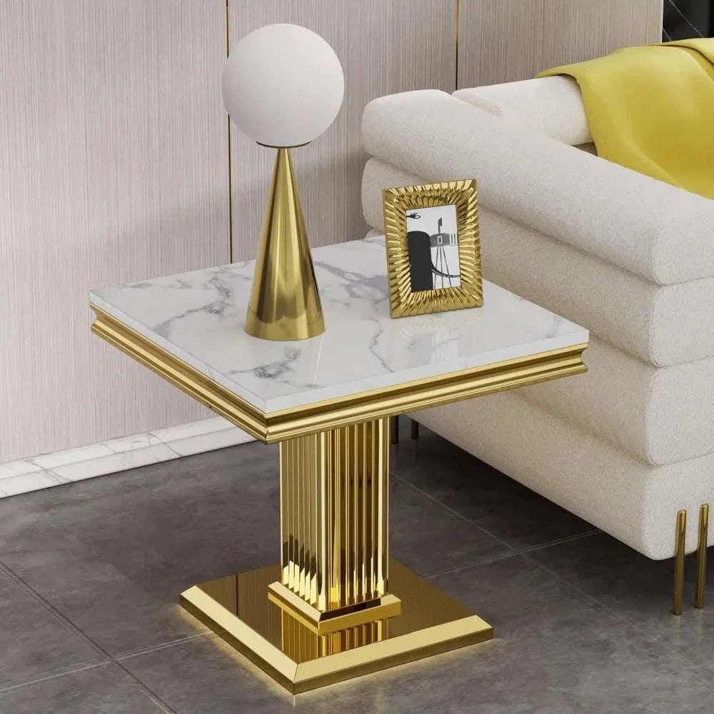 Decorative side table with gold base and marble top in a living room setting.