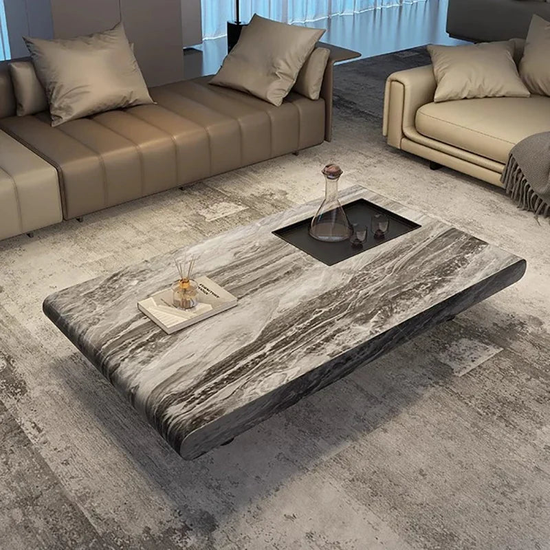 Modern living room with a marble coffee table and beige sofas.