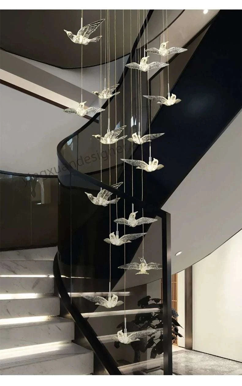 Decorative chandelier with crystal elements hanging from a staircase.