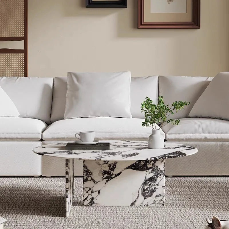 Modern living room with a white sofa and marble coffee table.