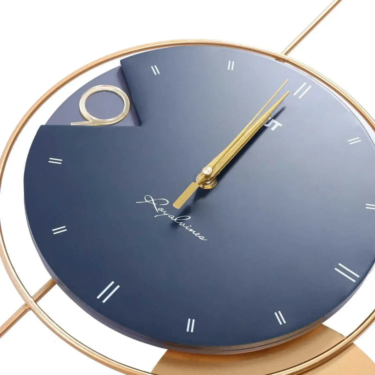 Modern luxury wall clock with navy blue face, gold hands, and stylish minimal design
